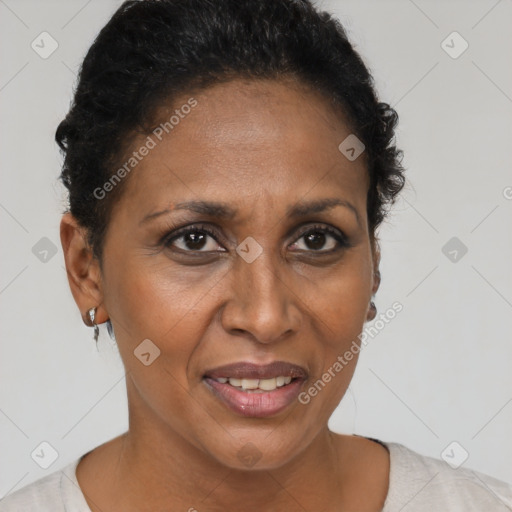 Joyful black adult female with short  brown hair and brown eyes