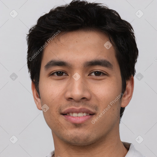 Joyful white young-adult male with short  black hair and brown eyes