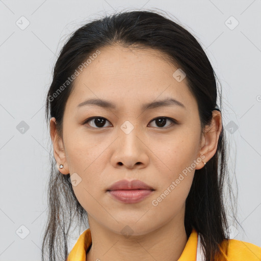 Joyful asian young-adult female with long  brown hair and brown eyes