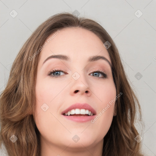 Joyful white young-adult female with long  brown hair and green eyes