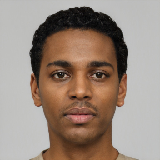 Neutral black young-adult male with short  black hair and brown eyes