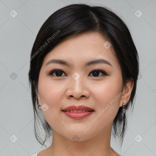 Joyful asian young-adult female with medium  black hair and brown eyes