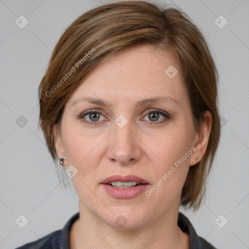 Joyful white adult female with medium  brown hair and grey eyes