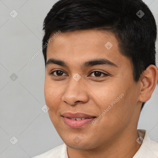 Joyful asian young-adult male with short  brown hair and brown eyes