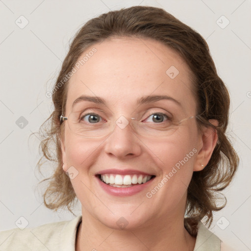 Joyful white adult female with medium  brown hair and blue eyes