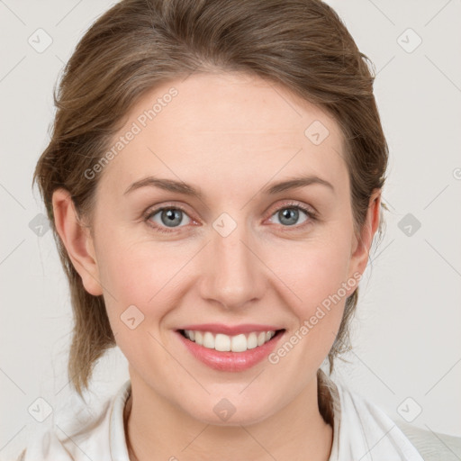 Joyful white young-adult female with medium  brown hair and blue eyes