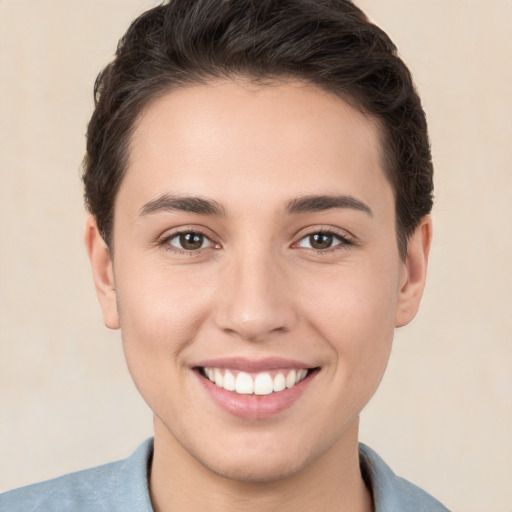 Joyful white young-adult female with short  brown hair and brown eyes