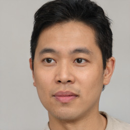 Neutral asian young-adult male with short  black hair and brown eyes