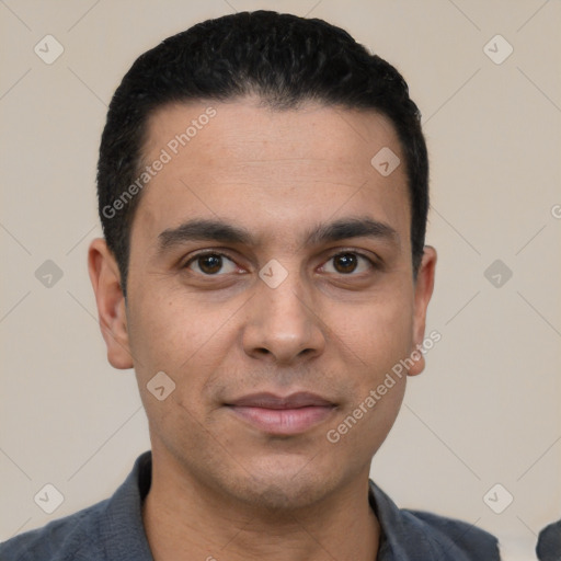 Joyful white young-adult male with short  black hair and brown eyes