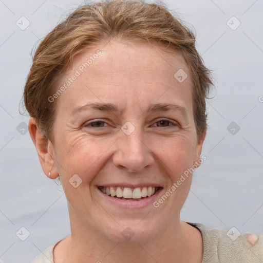 Joyful white adult female with short  brown hair and brown eyes