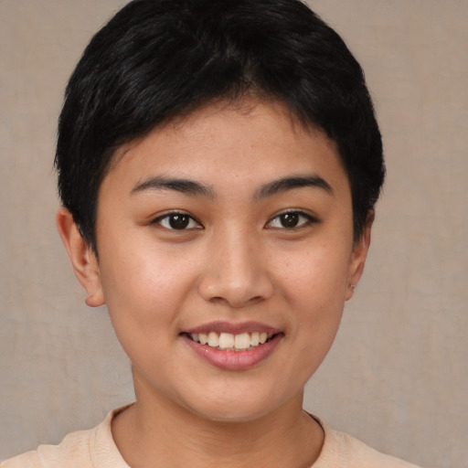 Joyful asian young-adult female with short  black hair and brown eyes