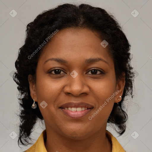 Joyful black young-adult female with medium  brown hair and brown eyes