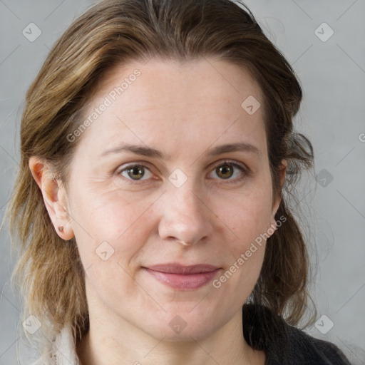 Joyful white adult female with medium  brown hair and grey eyes