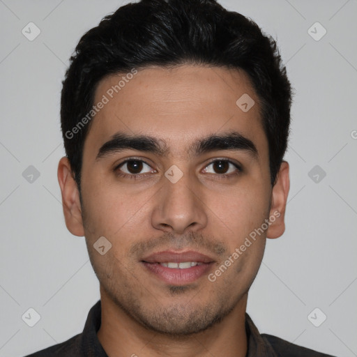 Joyful white young-adult male with short  black hair and brown eyes