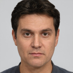 Neutral white adult male with short  brown hair and brown eyes
