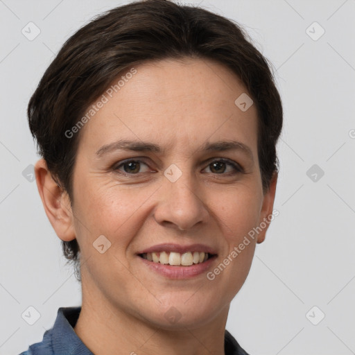 Joyful white adult female with short  brown hair and grey eyes