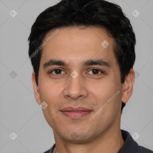 Joyful white young-adult male with short  black hair and brown eyes