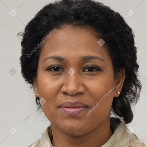 Joyful black adult female with medium  brown hair and brown eyes