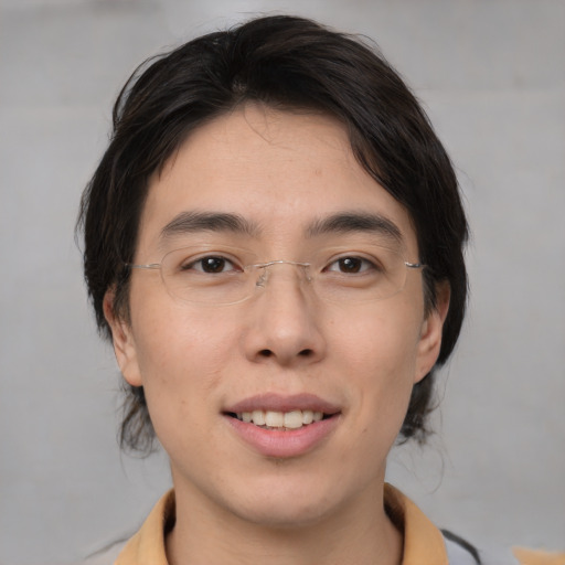 Joyful white young-adult male with medium  brown hair and brown eyes