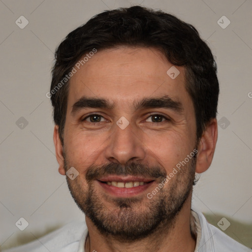 Joyful white young-adult male with short  black hair and brown eyes