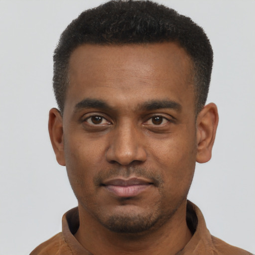 Neutral black young-adult male with short  black hair and brown eyes