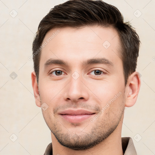 Joyful white young-adult male with short  brown hair and brown eyes