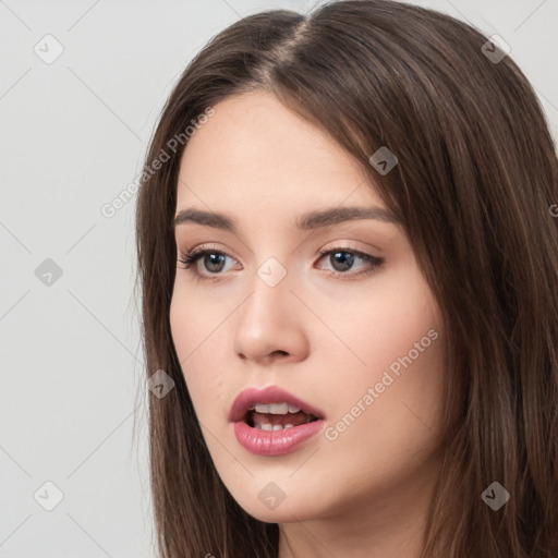 Neutral white young-adult female with long  brown hair and brown eyes