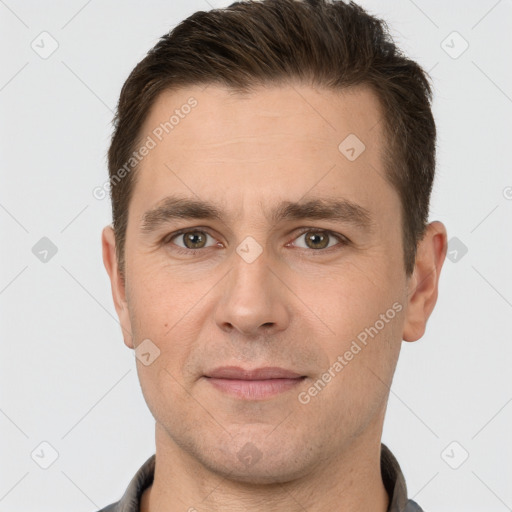 Joyful white young-adult male with short  brown hair and brown eyes