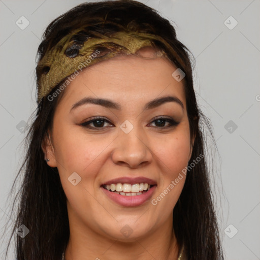 Joyful latino young-adult female with long  brown hair and brown eyes