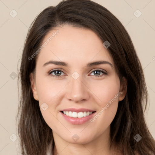 Joyful white young-adult female with long  brown hair and grey eyes