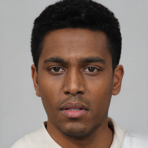 Neutral black young-adult male with short  black hair and brown eyes