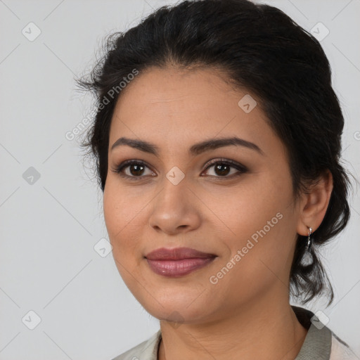 Joyful latino young-adult female with medium  black hair and brown eyes