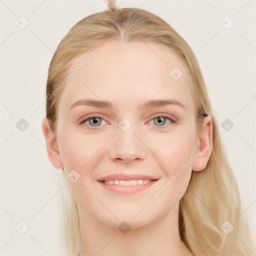 Joyful white young-adult female with long  brown hair and blue eyes