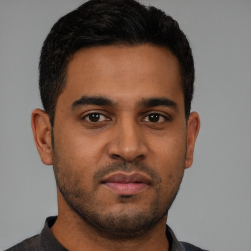 Neutral latino young-adult male with short  black hair and brown eyes