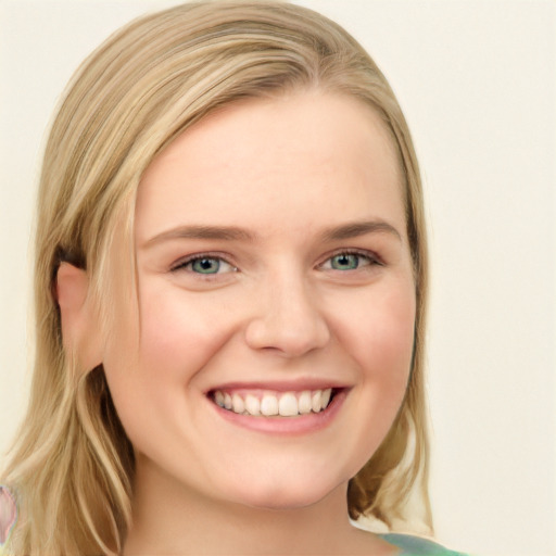 Joyful white young-adult female with long  brown hair and blue eyes