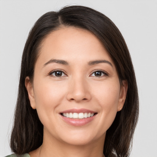 Joyful white young-adult female with medium  brown hair and brown eyes