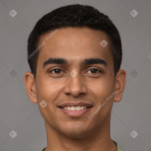 Joyful latino young-adult male with short  brown hair and brown eyes