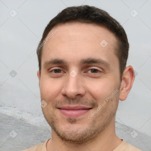 Joyful white young-adult male with short  brown hair and brown eyes