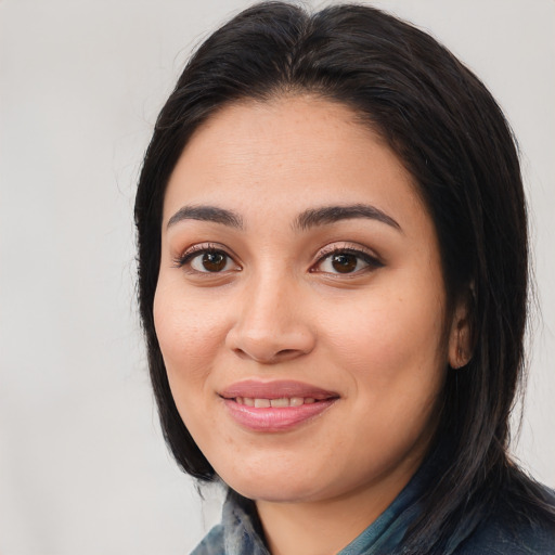 Joyful white young-adult female with medium  black hair and brown eyes