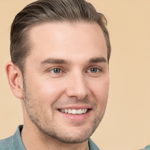 Joyful white young-adult male with short  brown hair and brown eyes