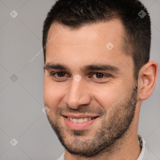 Joyful white young-adult male with short  brown hair and brown eyes