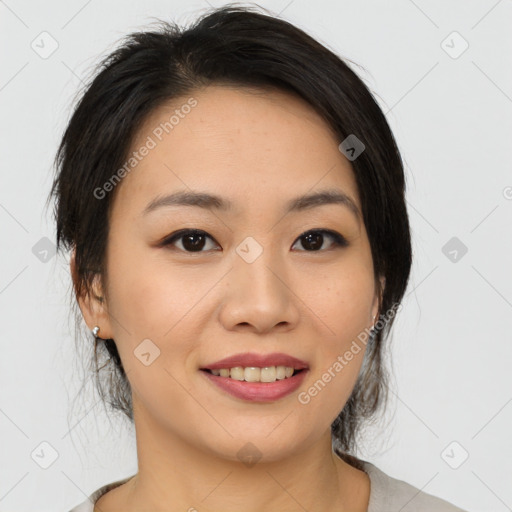 Joyful asian young-adult female with medium  black hair and brown eyes