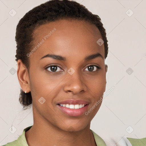 Joyful black young-adult female with short  brown hair and brown eyes