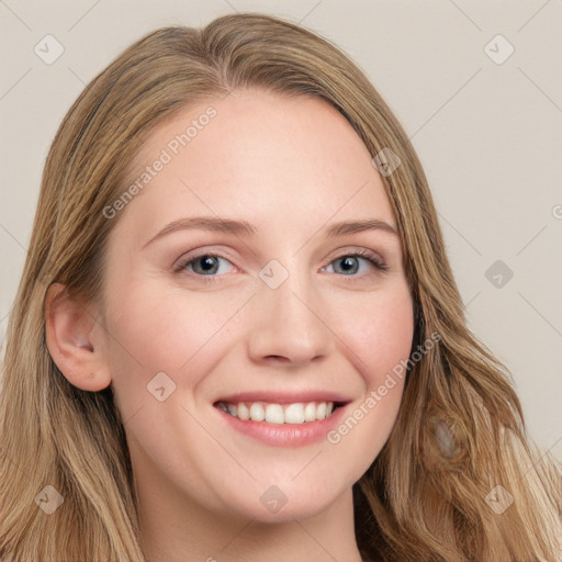 Joyful white young-adult female with long  brown hair and blue eyes