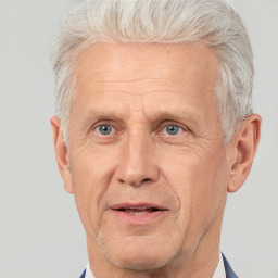 Joyful white middle-aged male with short  gray hair and brown eyes