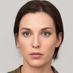 Neutral white young-adult female with medium  brown hair and brown eyes