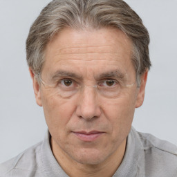 Joyful white middle-aged male with short  brown hair and brown eyes