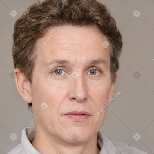 Joyful white adult male with short  brown hair and grey eyes