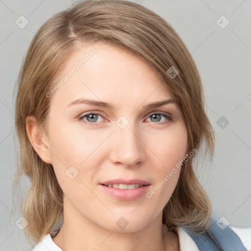 Joyful white young-adult female with medium  brown hair and blue eyes