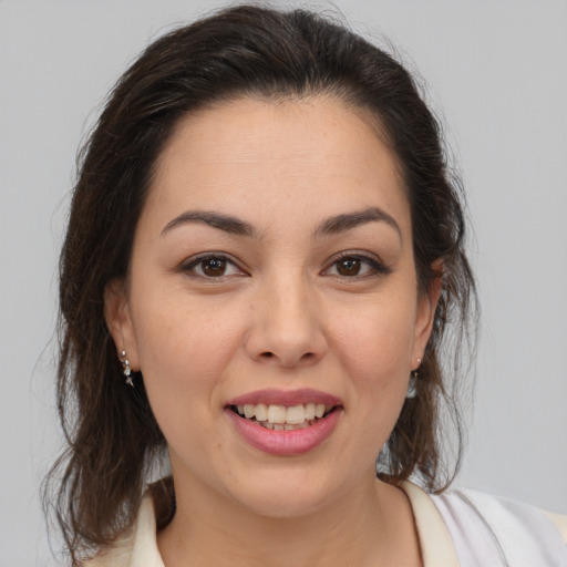 Joyful white young-adult female with medium  brown hair and brown eyes